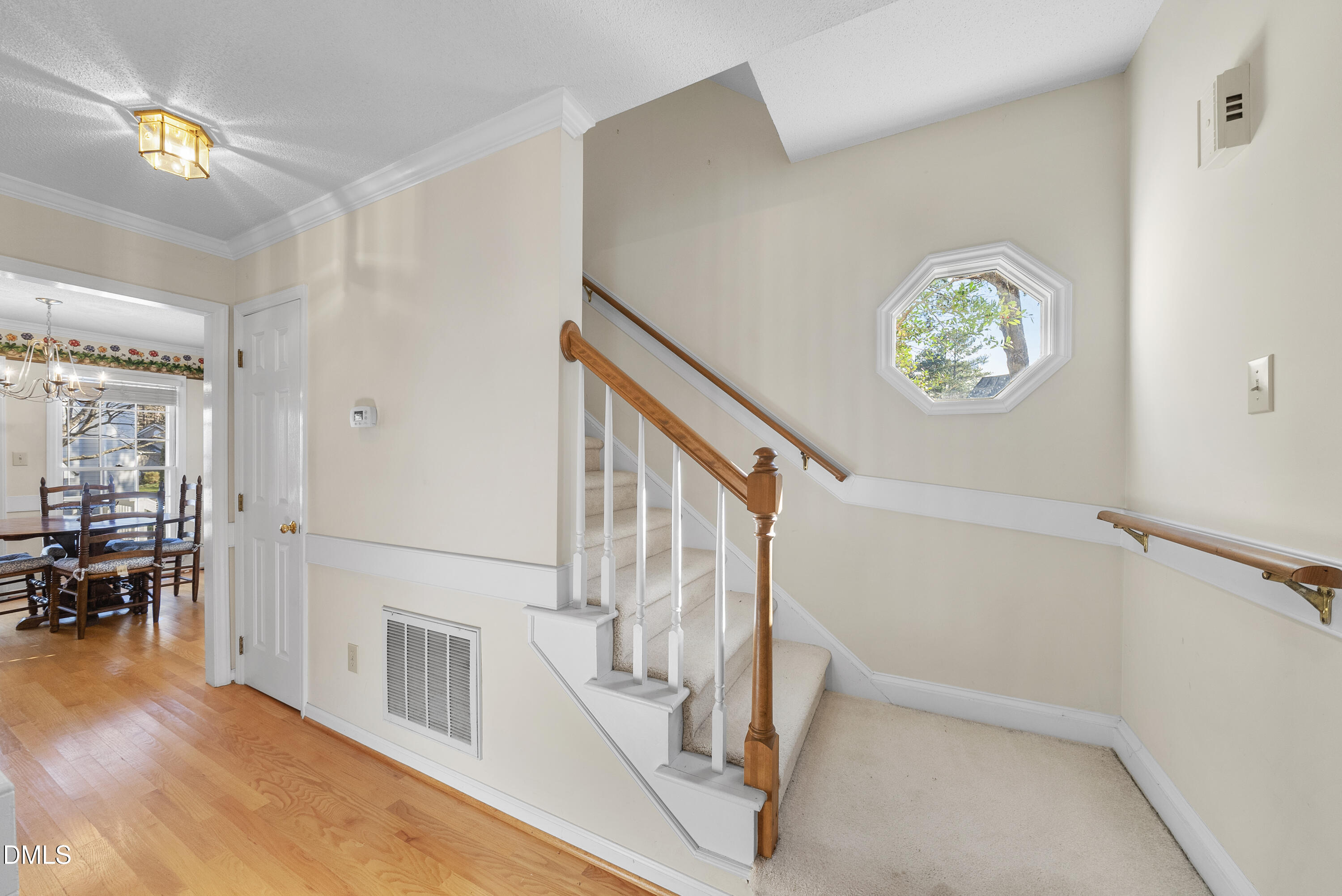 7104 Kinross Drive Raleigh, NC 27613 - Photo 7 of 38 a view of an entryway with wooden floor
