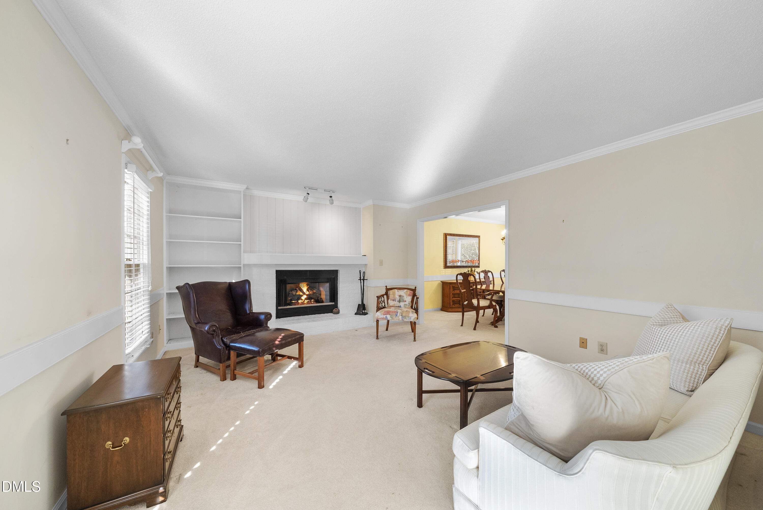 7104 Kinross Drive Raleigh, NC 27613 - Photo 9 of 38 a living room with furniture and a fireplace