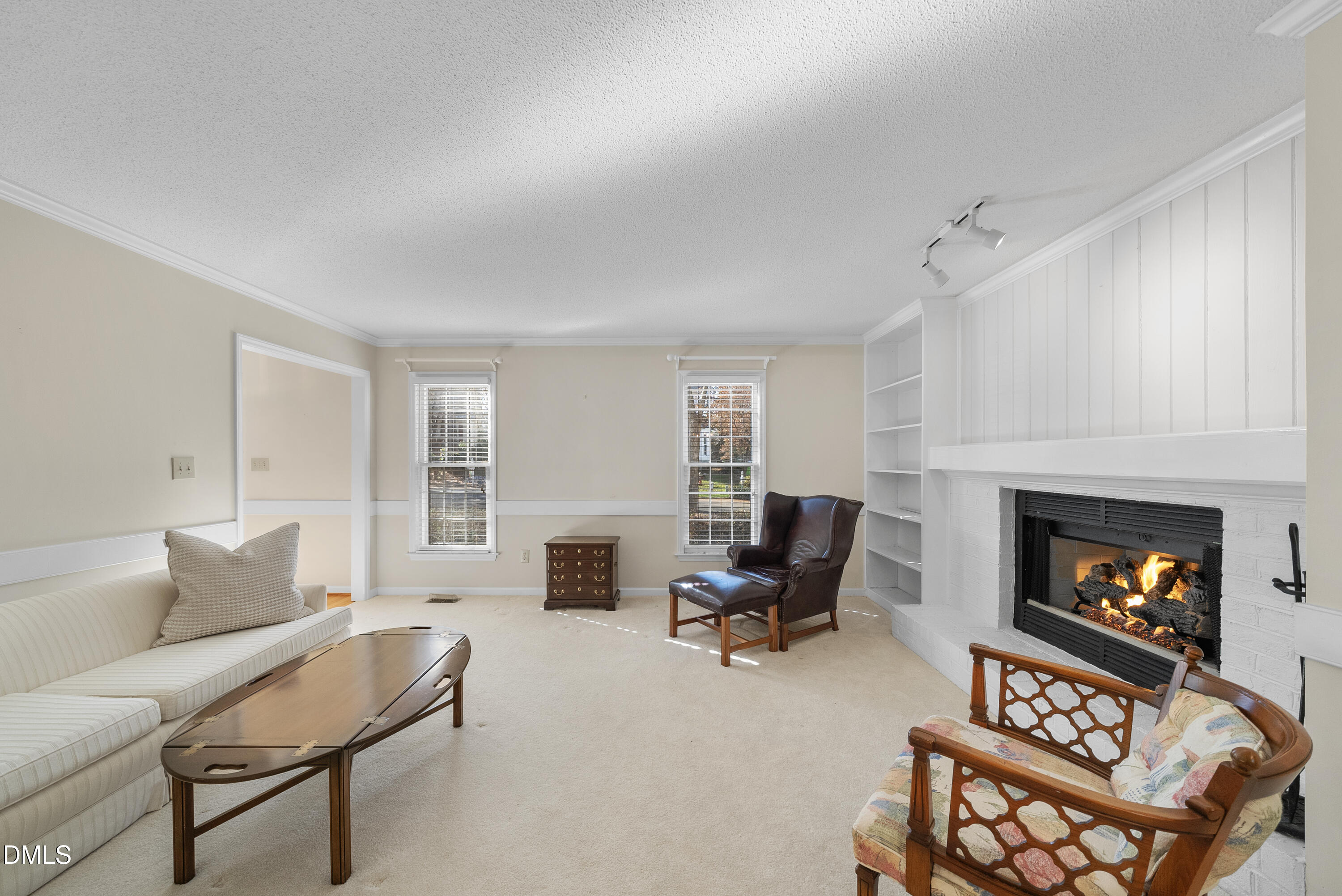 7104 Kinross Drive Raleigh, NC 27613 - Photo 11 of 38 a living room with furniture and a fireplace