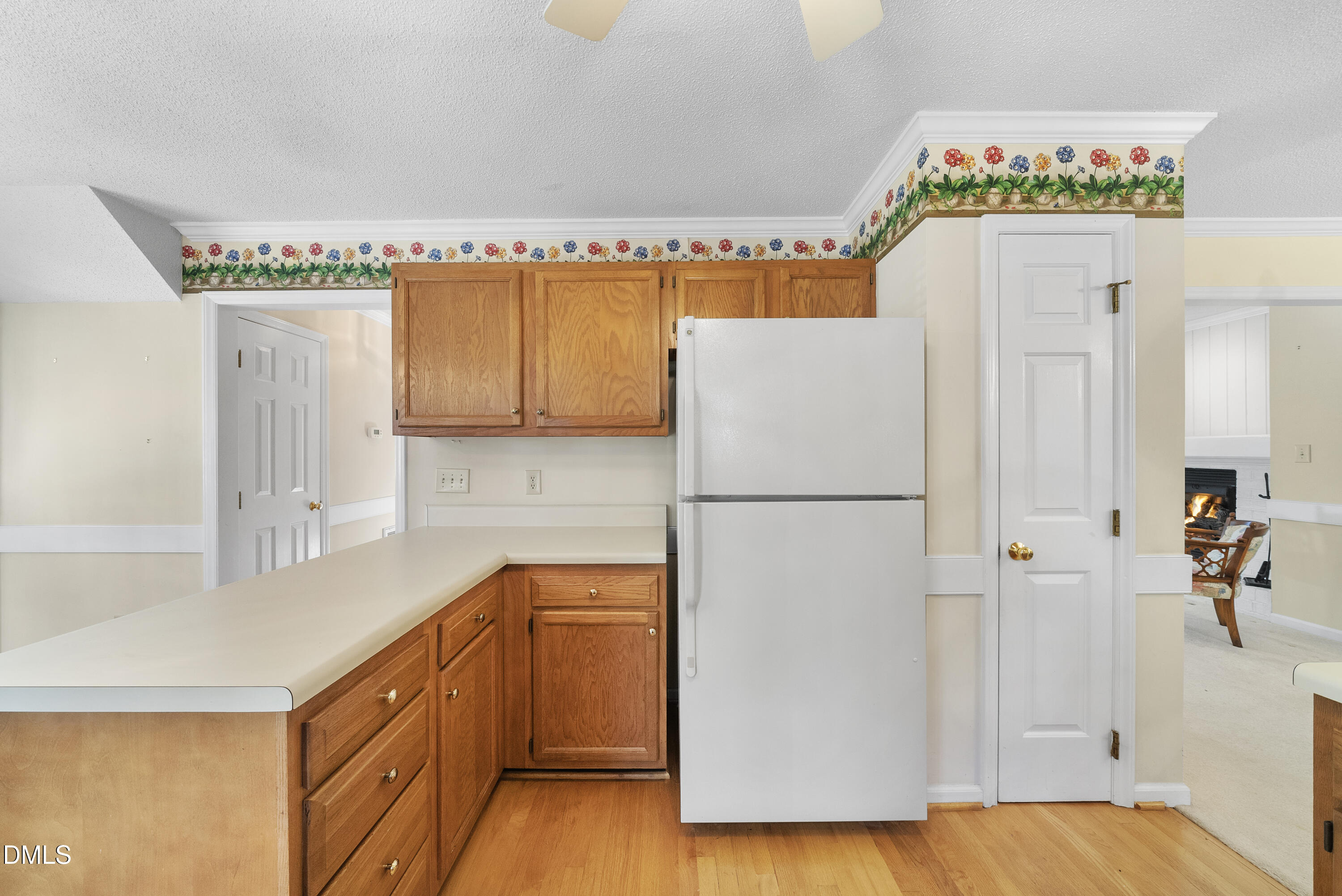 7104 Kinross Drive Raleigh, NC 27613 - Photo 14 of 38 a kitchen with a refrigerator and a sink
