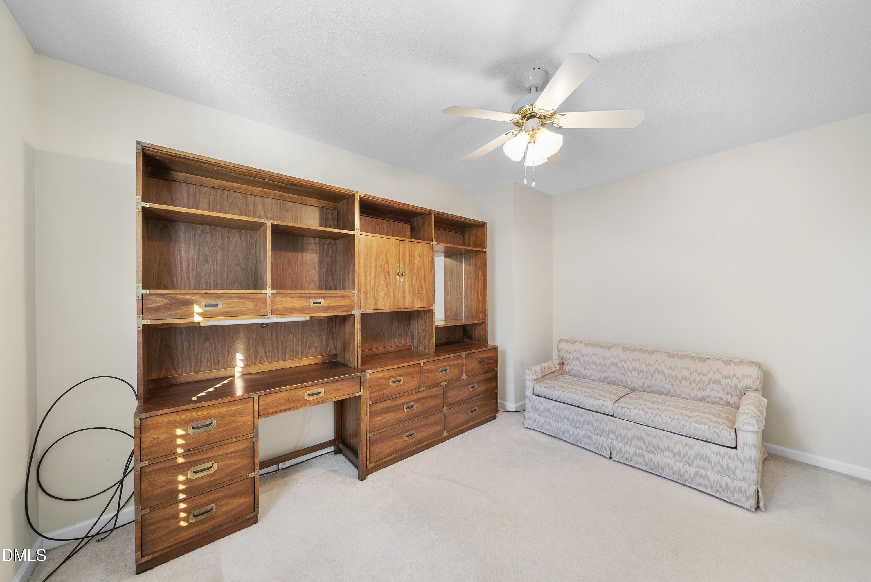7104 Kinross Drive Raleigh, NC 27613 - Photo 25 of 38 a living room with furniture and a ceiling fan