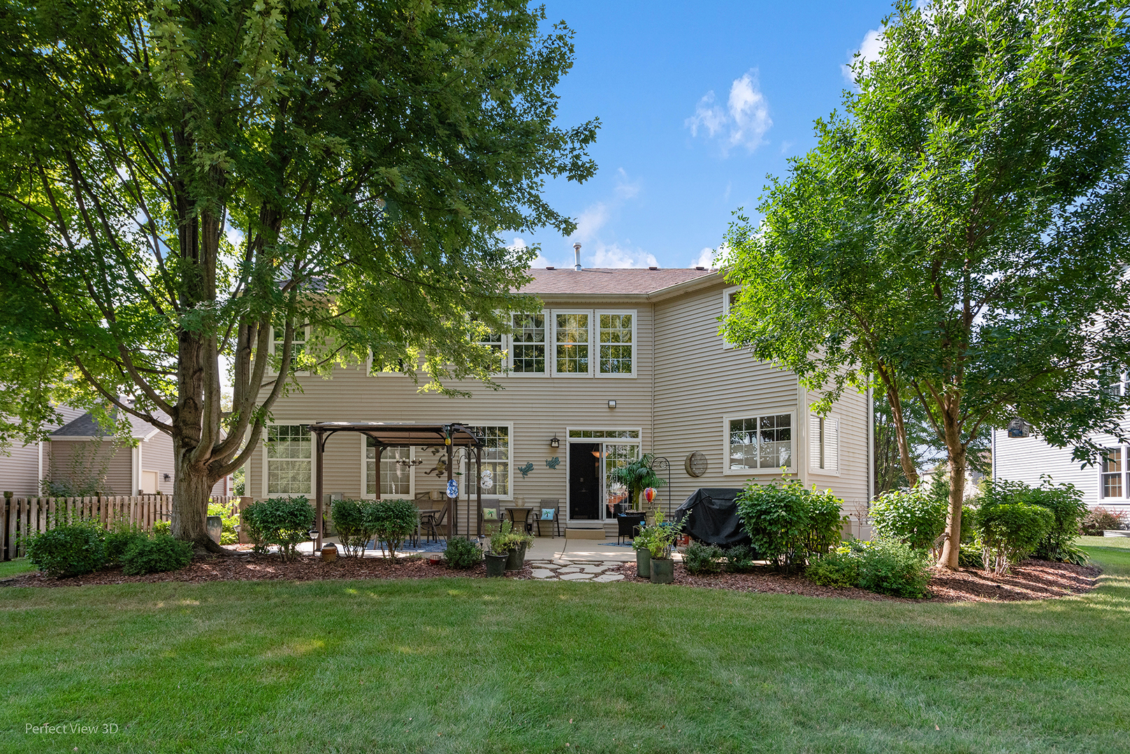 2733 Berman Road North Aurora, IL 60542 - Photo 23 of 24 a front view of a house with a garden and patio