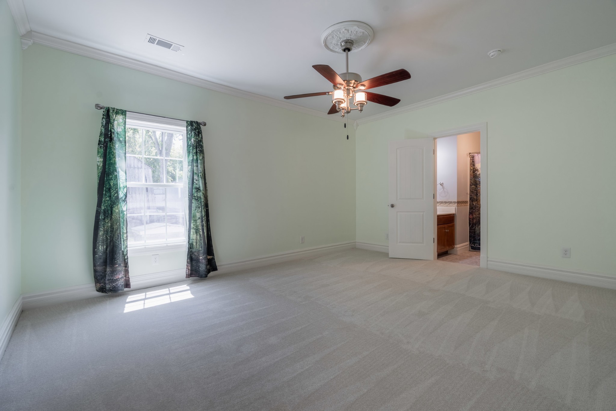 4870 Chicken Road Lebanon, TN 37090 - Photo 17 of 50 an empty room with windows and fan
