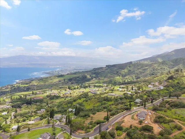 a view of a garden with a building