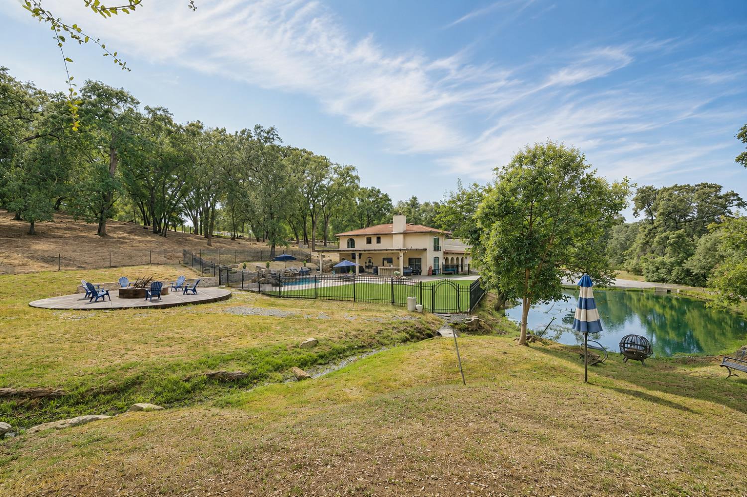 3340 Garden Bar Road Lincoln, CA 95648 - Photo 51 of 56 a view of a swimming pool with a yard and large trees