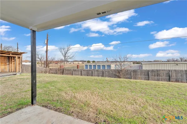 a house view with a backyard space