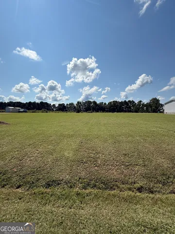 a view of an ocean and in a cloudy sky