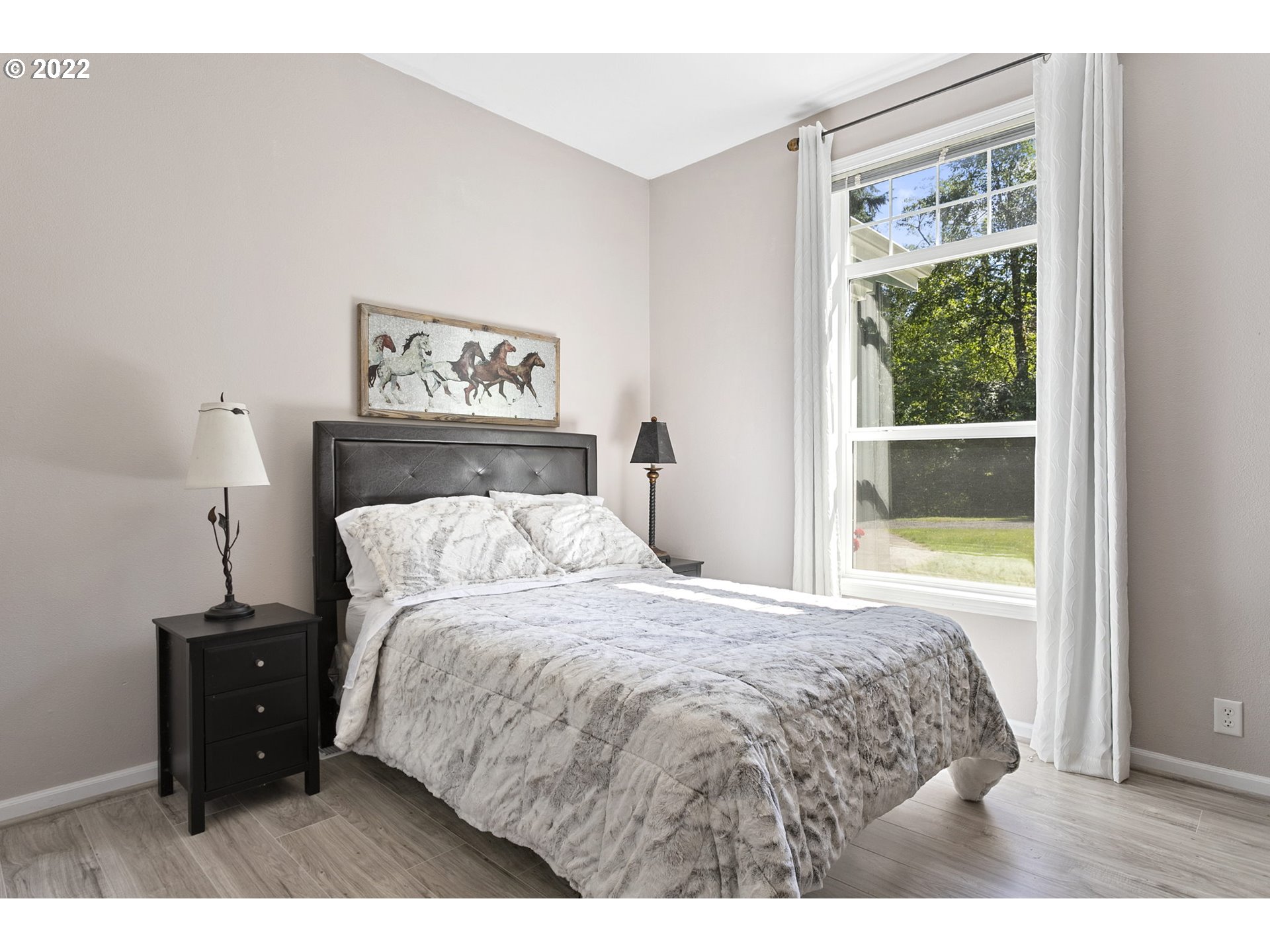 71572 Pruitt Road Rainier, OR 97048 - Photo 20 of 31 a bed room with a bed and a painting