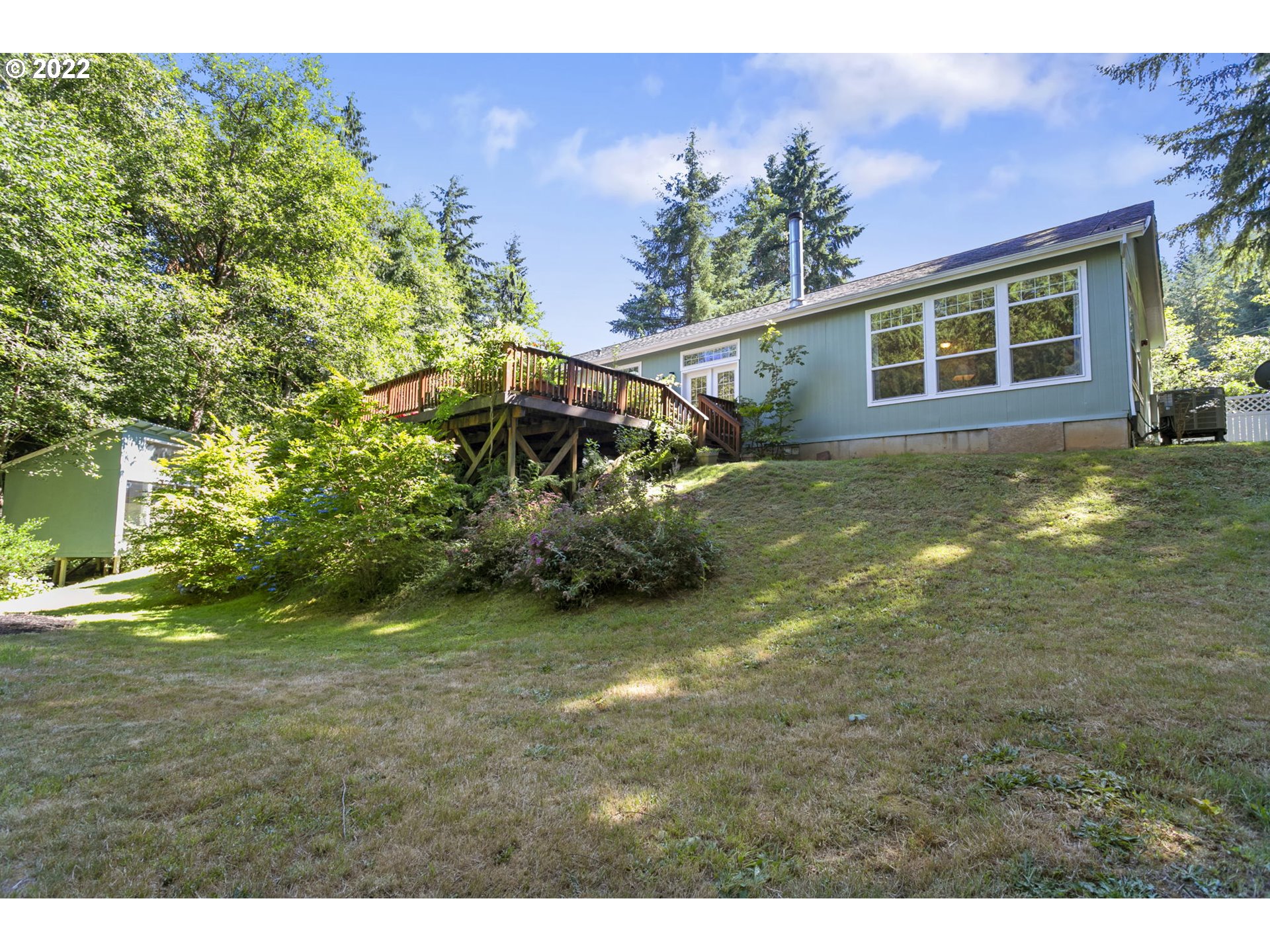 71572 Pruitt Road Rainier, OR 97048 - Photo 28 of 31 a view of a yard in front of a house with a large tree