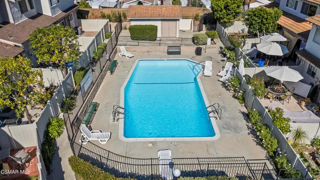 an aerial view of a house with swimming pool