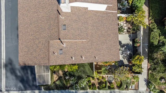 a aerial view of a house with a yard