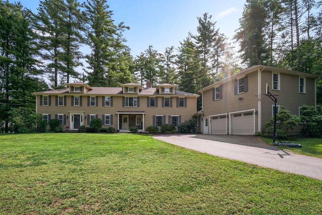 34 Wake Robin Road Sudbury, MA 01776 - Photo 1 of 34 a front view of a house with a garden