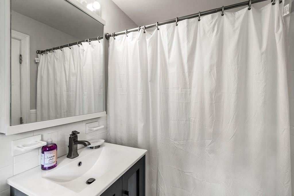 34 Wake Robin Road Sudbury, MA 01776 - Photo 19 of 34 a bathroom with a sink and a mirror