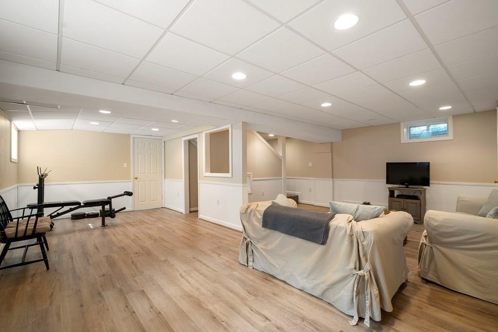 34 Wake Robin Road Sudbury, MA 01776 - Photo 23 of 34 a living room with furniture and a wooden floor