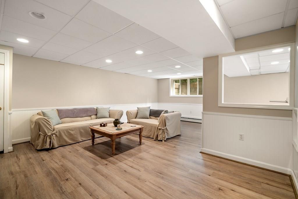 34 Wake Robin Road Sudbury, MA 01776 - Photo 24 of 34 a living room with furniture and wooden floor