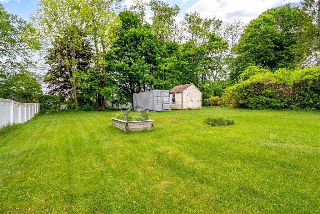 54 Charles Street Gardner, MA 01440 - Photo 37 of 40 a view of a backyard with swimming pool