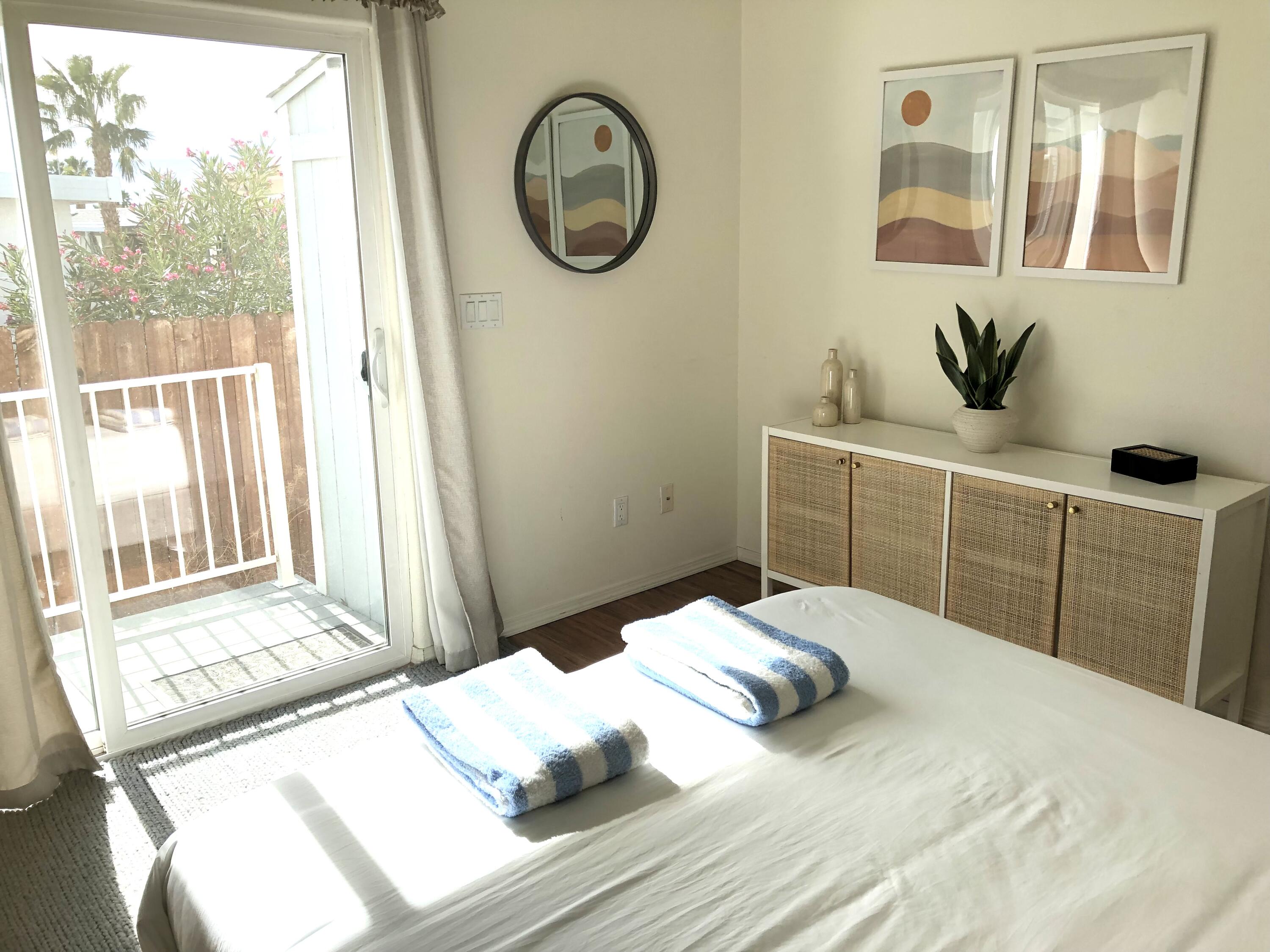 74711 Dillon Road Desert Hot Springs, CA 92241 - Photo 11 of 38 a bedroom with a bed and a window