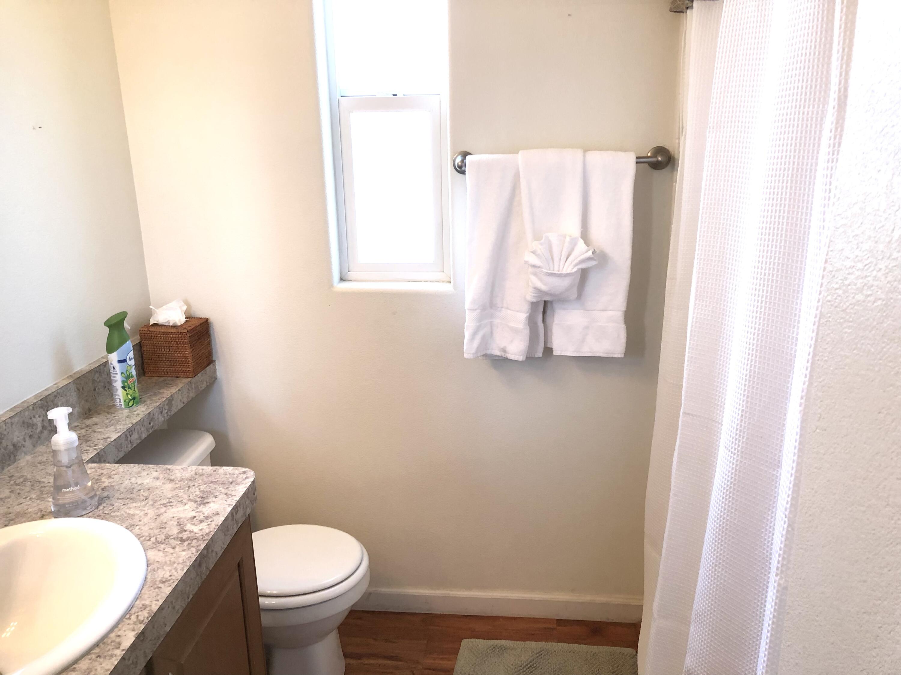 74711 Dillon Road Desert Hot Springs, CA 92241 - Photo 13 of 38 a bathroom with a granite countertop sink and a mirror