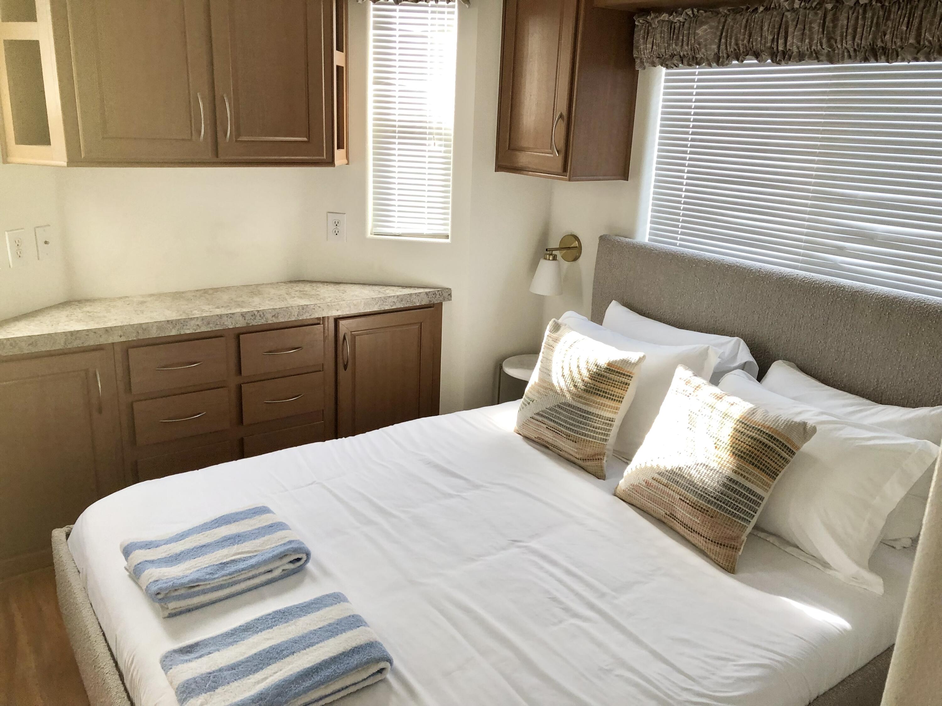 74711 Dillon Road Desert Hot Springs, CA 92241 - Photo 14 of 38 a bedroom with a bed and a window