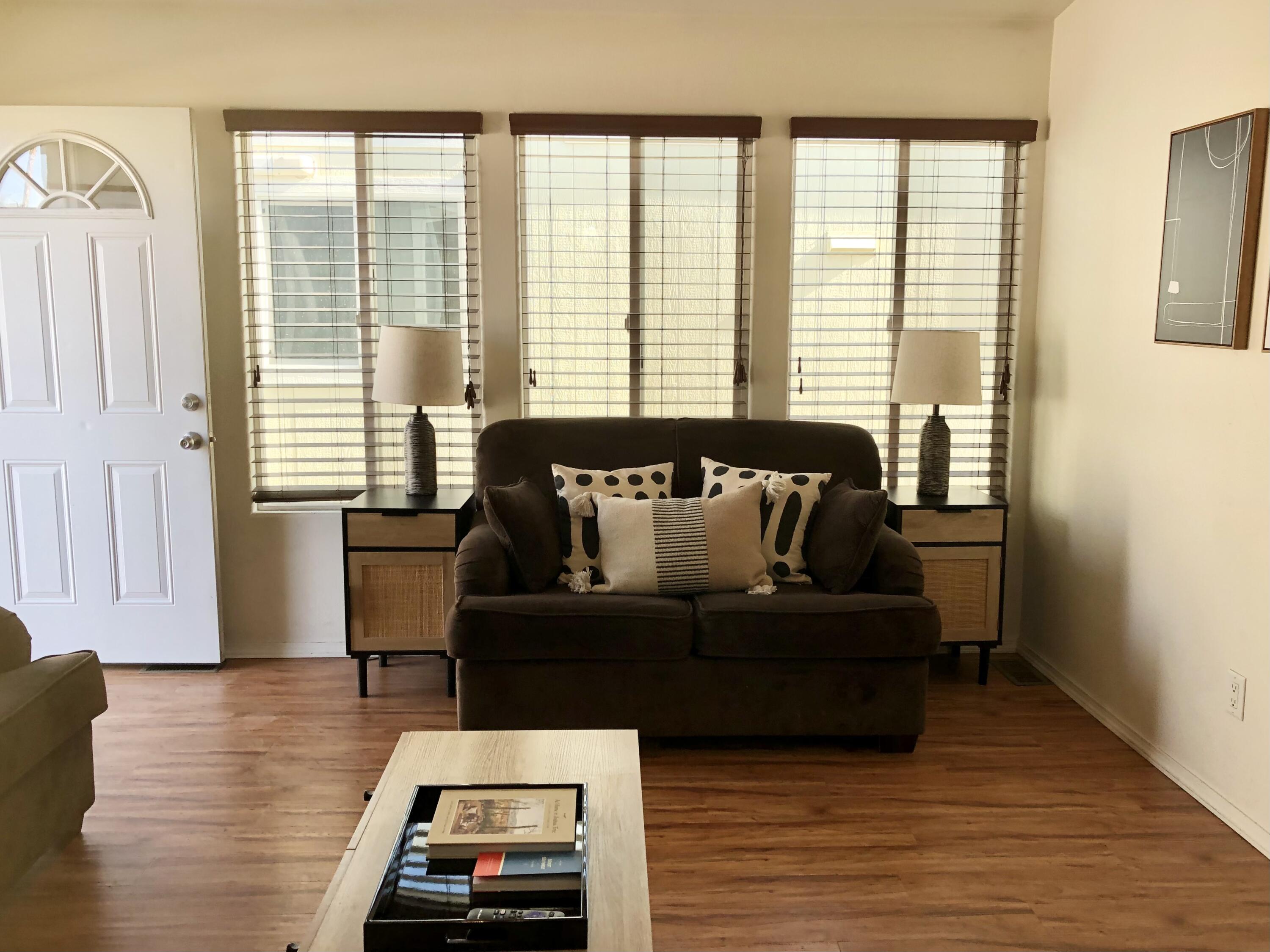 74711 Dillon Road Desert Hot Springs, CA 92241 - Photo 7 of 38 a living room with furniture and wooden floor