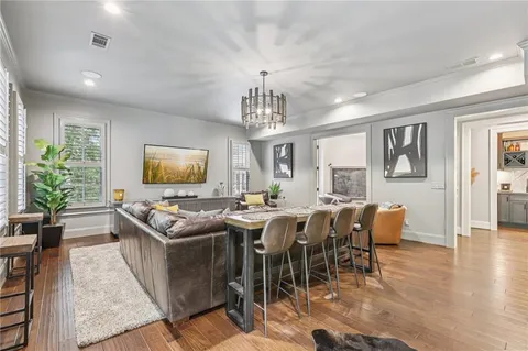 a view of a dining room with furniture and chandelier