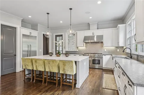 a very nice looking dining room with furniture window and wooden floor