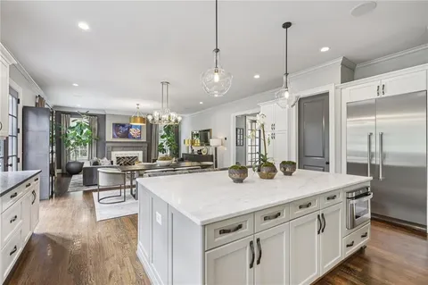 a view of staircase with wooden floor and a window
