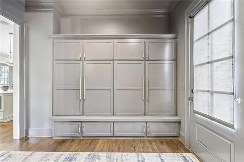 a bathroom with a granite countertop sink toilet a large mirror a bathtub and shower