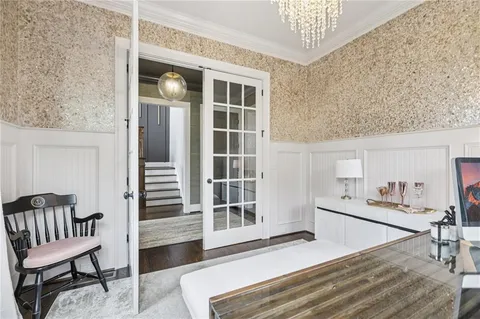 a living room with furniture and a rug