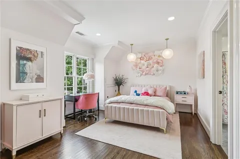 a bathroom with a double vanity sink mirror and a bathtub