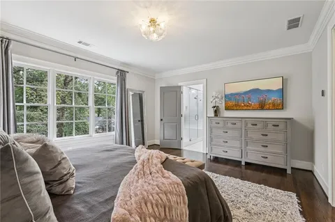 a bathroom with a granite countertop sink toilet a mirror and shower