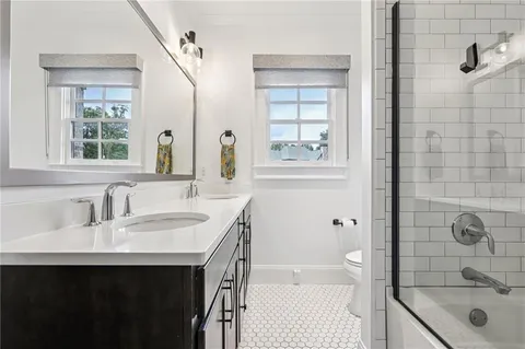 a view of a porch with a table and chairs