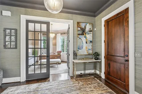 a living room with furniture a window and a fireplace