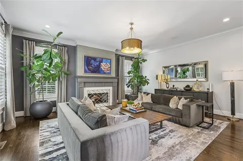 a living room with furniture dining table and a large window