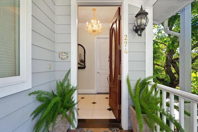 a kitchen with granite countertop kitchen island stainless steel appliances a table and chairs