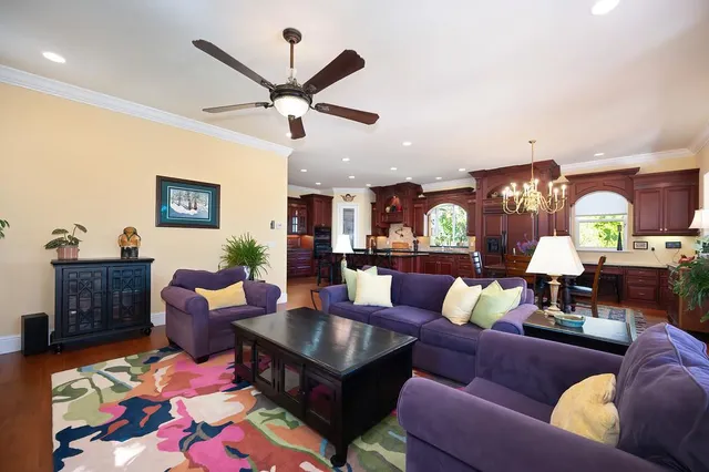 a bathroom with a granite countertop sink a mirror a vanity and shower