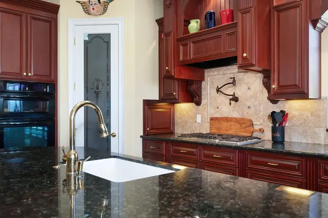 a bedroom with two beds and a chandelier