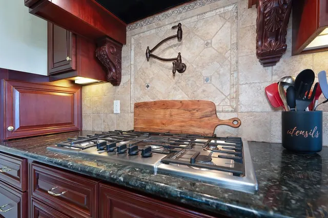 a bedroom with two beds and a chandelier