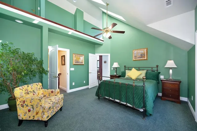 a kitchen with a stove top oven a sink dishwasher and a dining table with wooden floor