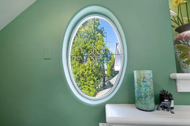 a bedroom with bed and window
