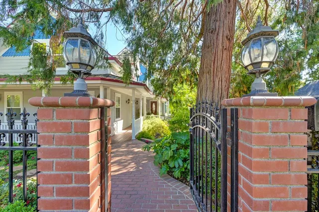 a view of a house with a flower garden