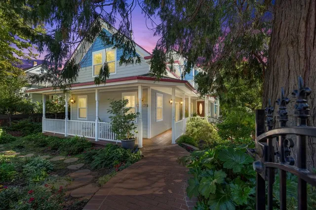 a living room with furniture kitchen view and a fireplace