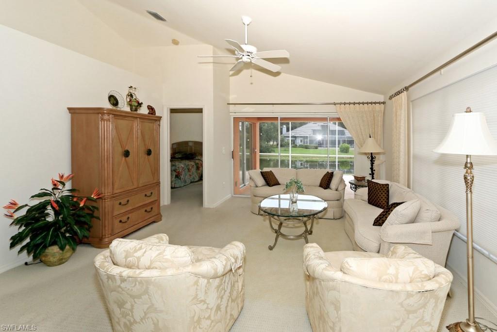 214 Napa Ridge Road East Naples, FL 34119 - Photo 1 of 12 a living room with furniture and a large window