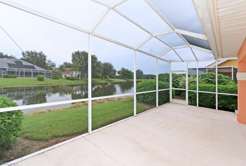214 Napa Ridge Road East Naples, FL 34119 - Photo 11 of 12 a view of a house with a big yard