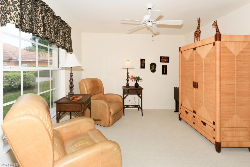 214 Napa Ridge Road East Naples, FL 34119 - Photo 9 of 12 a living room with furniture