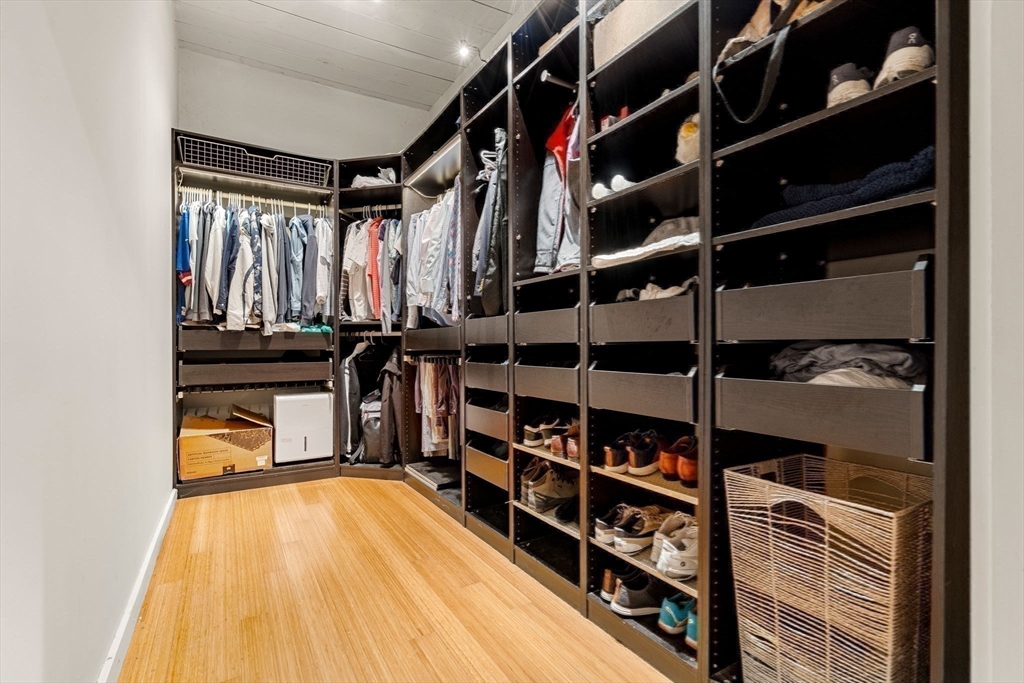 1511 Main Street, Unit B101 Worcester, MA 01603 - Photo 24 of 41 a view of walk in closet with clothes and shoes