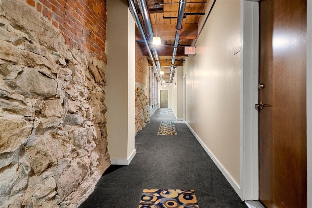 1511 Main Street, Unit B101 Worcester, MA 01603 - Photo 30 of 41 a view of a hallway