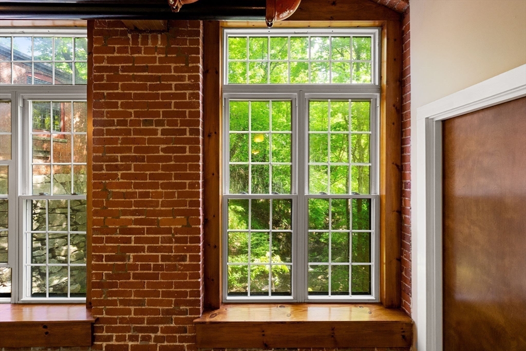 1511 Main Street, Unit B101 Worcester, MA 01603 - Photo 31 of 41 a view of a glass door and a window