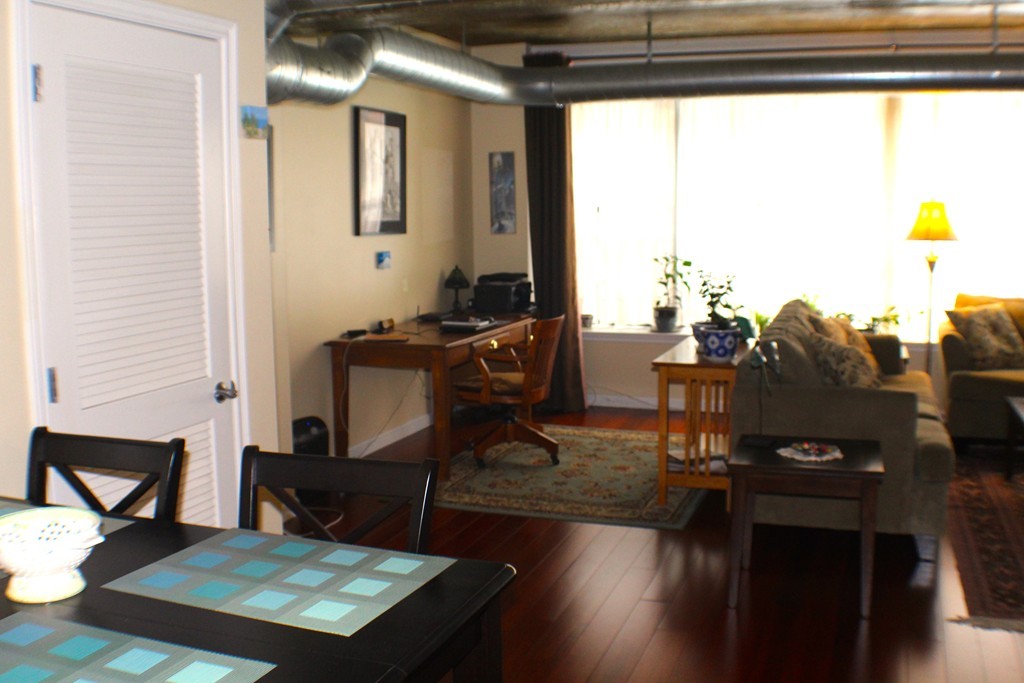 23-33 Middle Street, Unit 4 Lowell, MA 01852 - Photo 2 of 5 a view of a workspace with furniture and a window