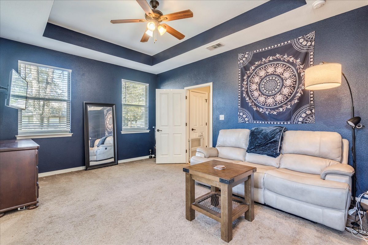 11 Rhapsody Lane Wimberley, TX 78676 - Photo 12 of 35 a living room with furniture a window and a chandelier